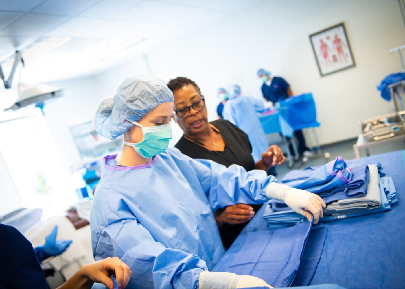 Healthcare student in a clinical learning environment preparing for surgical team roles